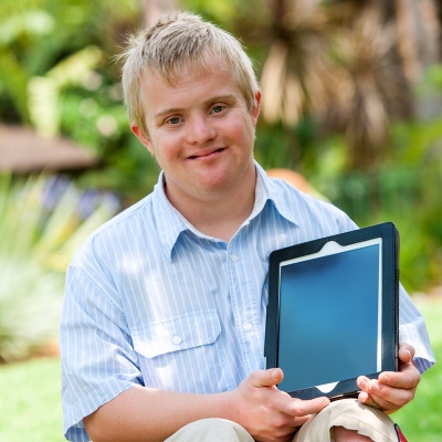 handicapped-boy-holding-tablet.jpg